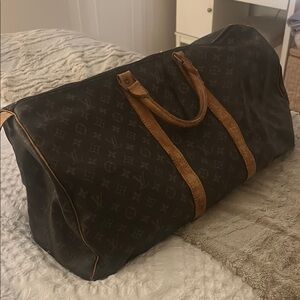 Louis Vuitton Black and Brown duffle bags